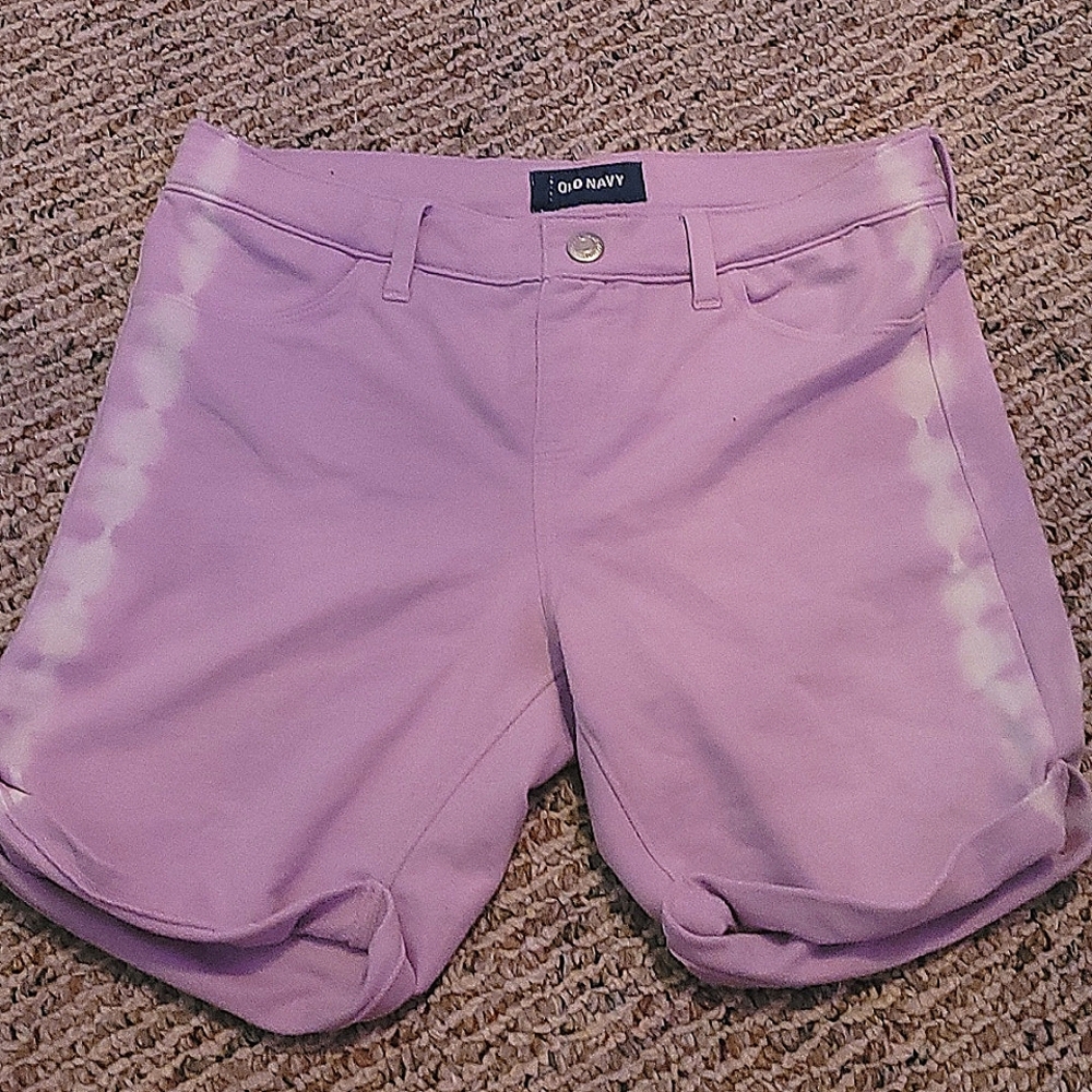 Purple shorts with a white design on the sides.